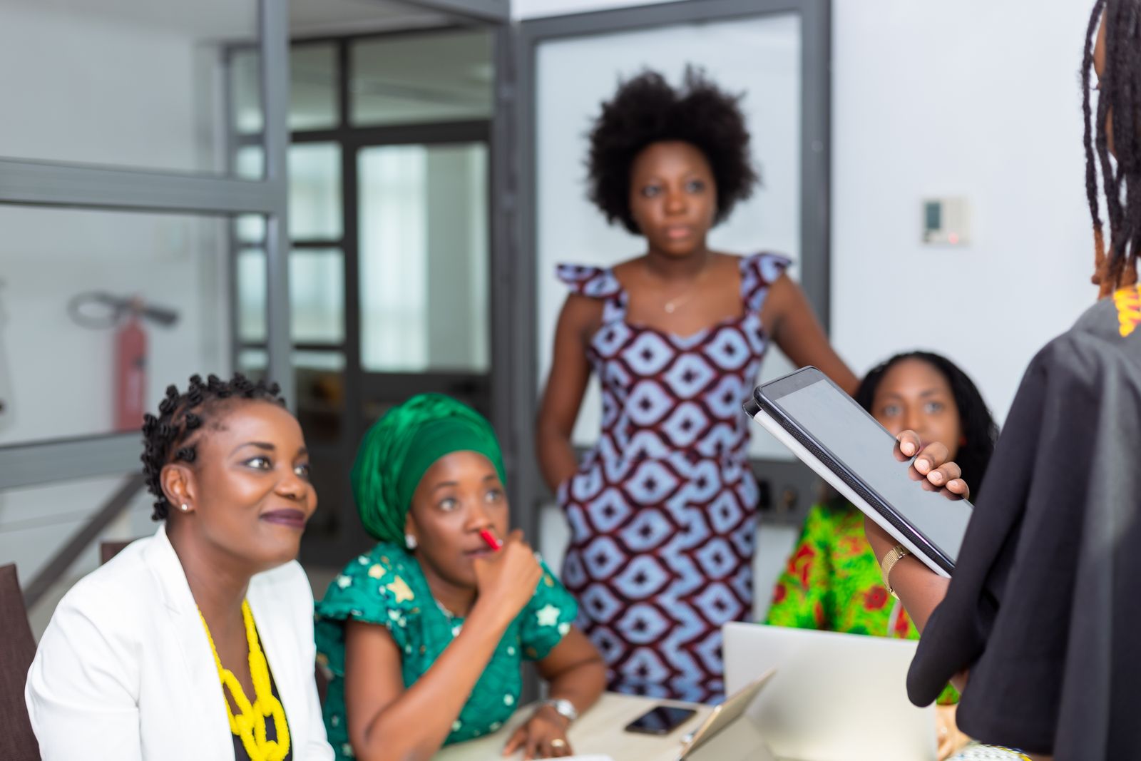 Diverse leaders collaborating in a commercial workshop